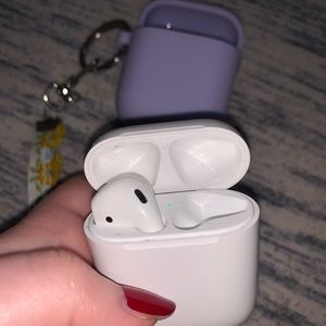 Apple AirPods Charging Case and Left AirPod